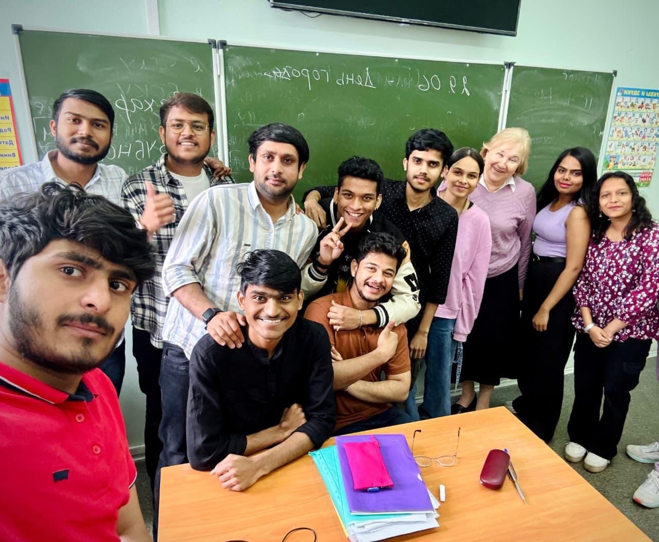 Indian students with their professor in a university classroom