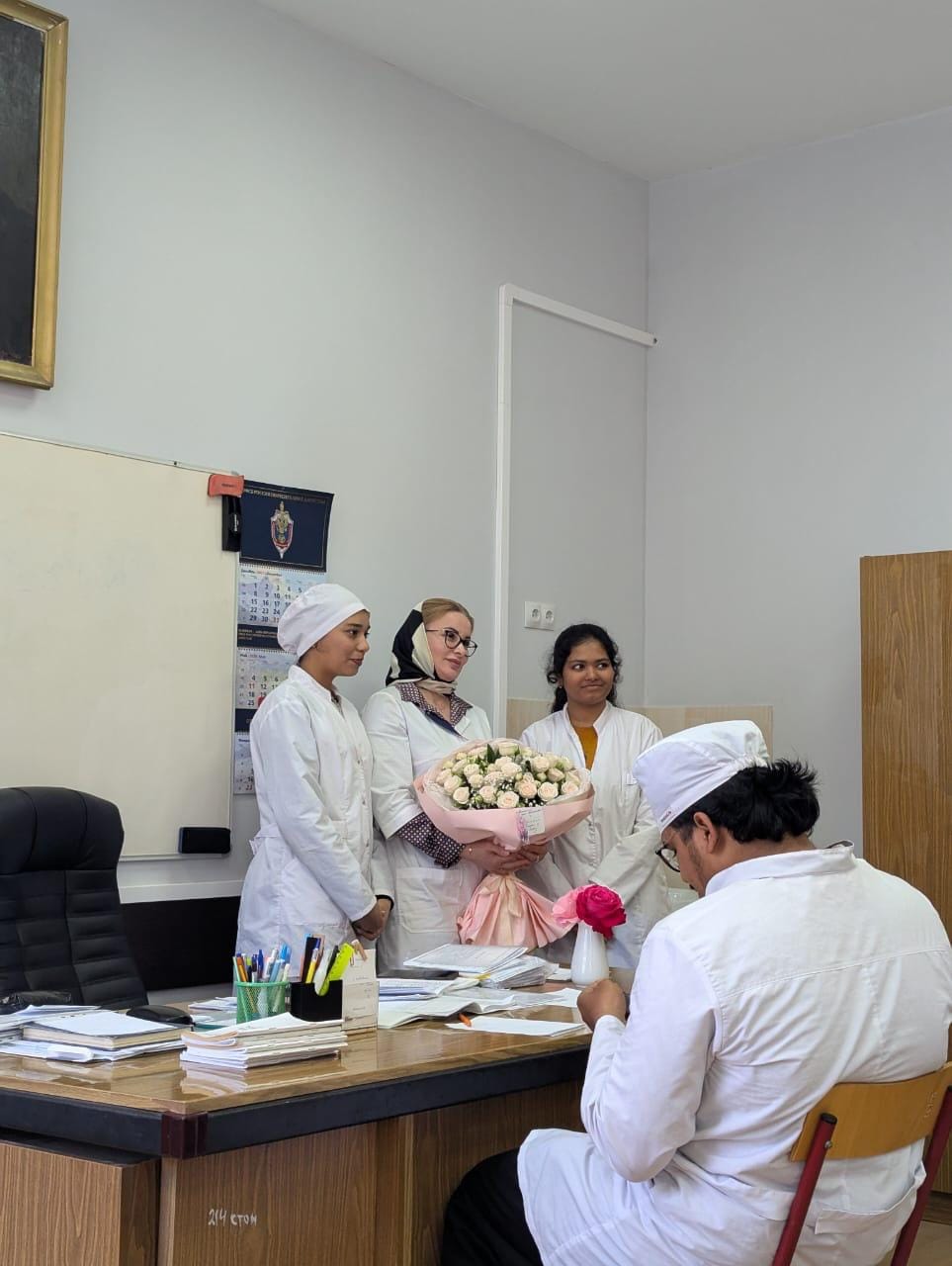 Students thanking their professor with flowers